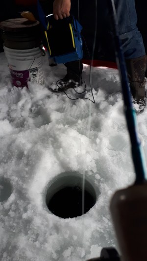 Ice Fishing through the hole