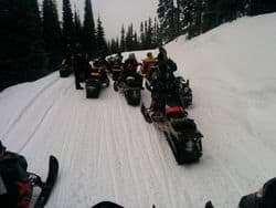 Snowmobiling heading out on teh trails