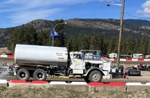 Truck sprays water on track